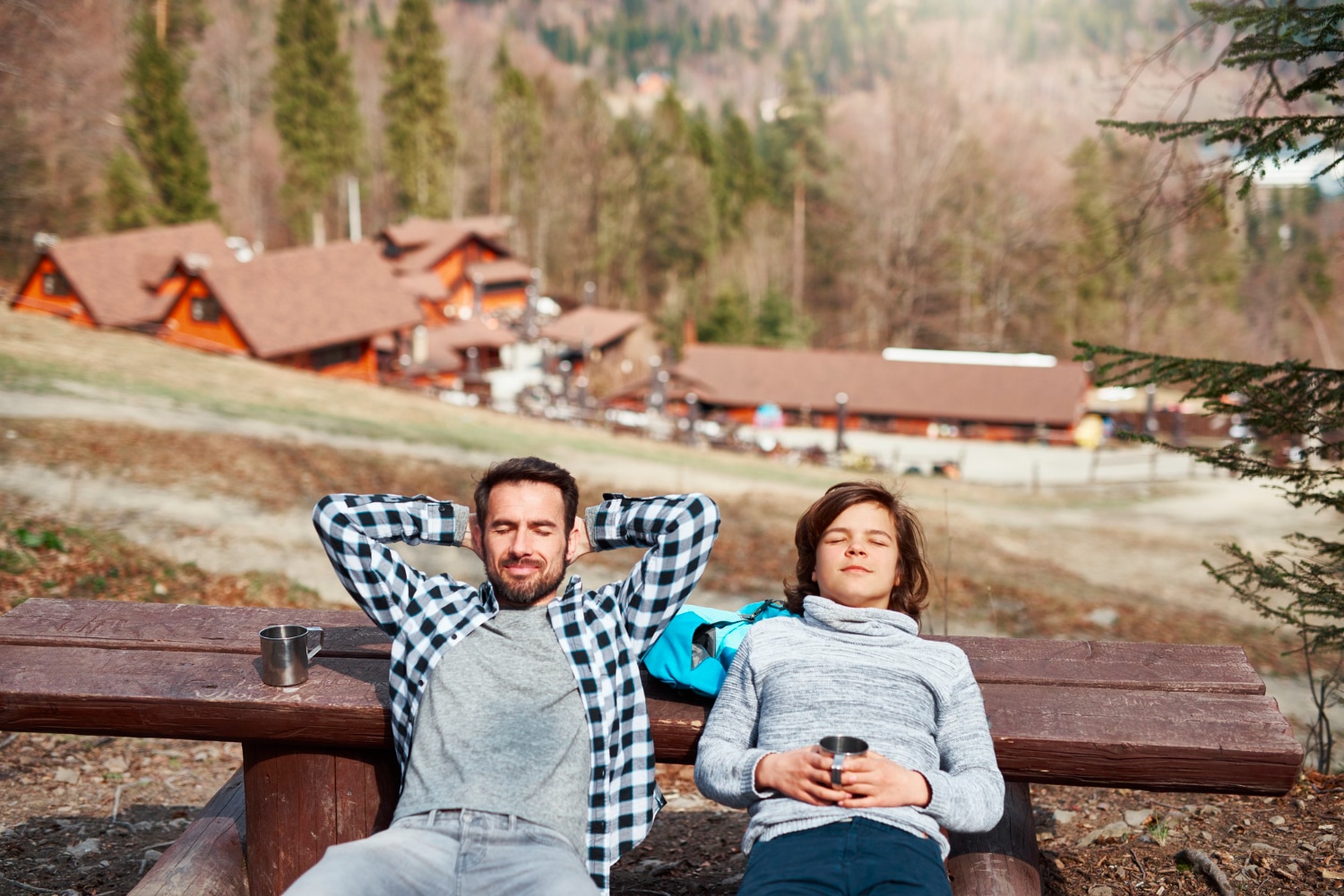 smiling-father-son-with-closed-eyes-relaxing-outdoors-2